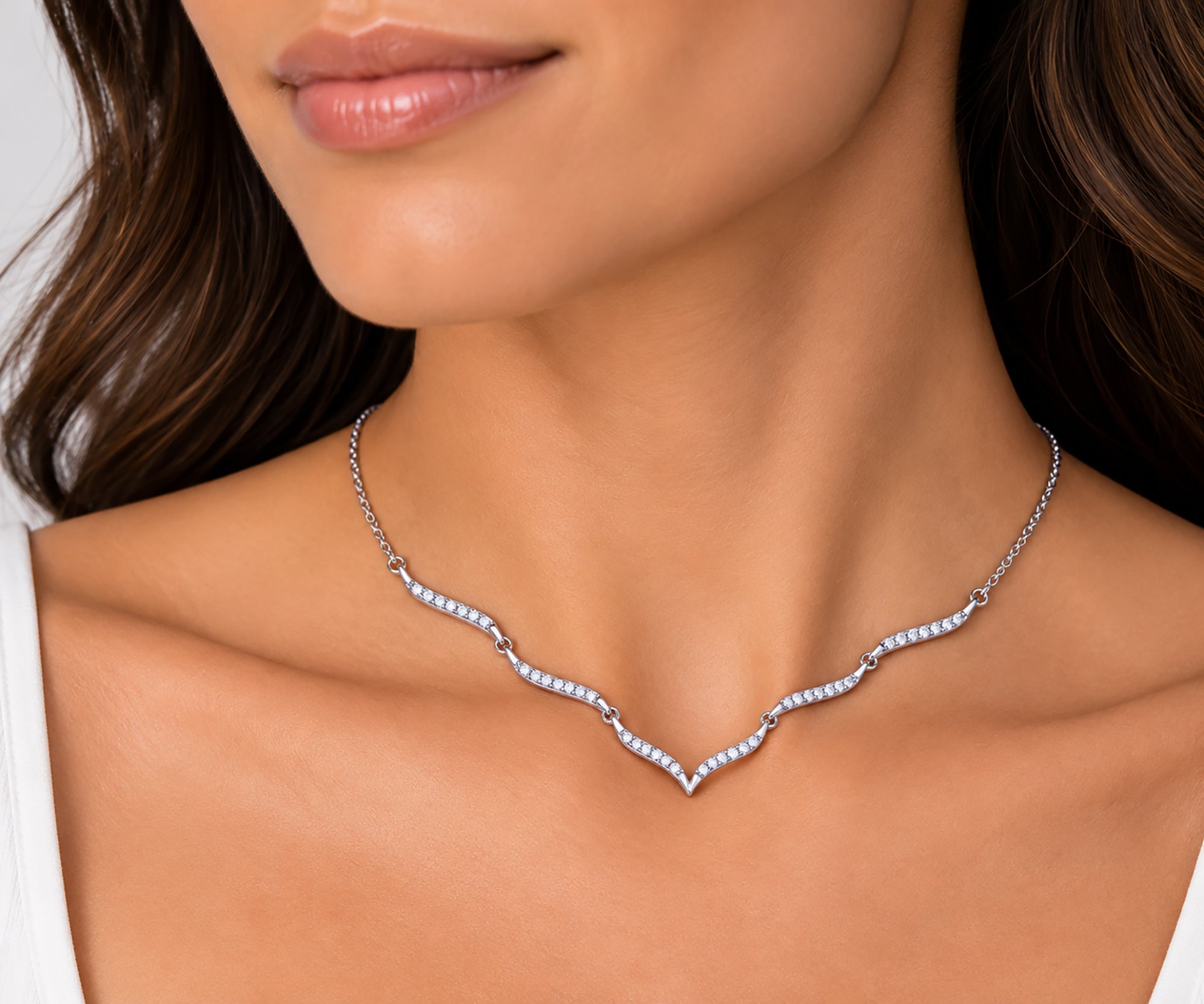 Shop our sterling silver wave necklace featuring 42 sparkling